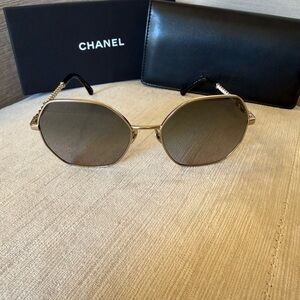 CHANEL Gold Sunglasses with Black Temples